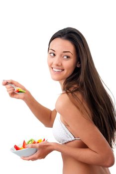 Young attractive woman holding fruit bowl.Isolated