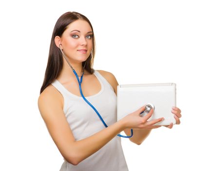 Young girl with laptop and stethoscope isolated