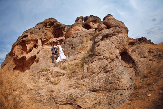 bride and groom in the mountains