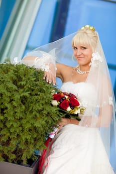 happy bride by the wall