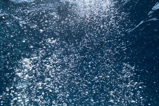 background of sunlight bubbles in deep water