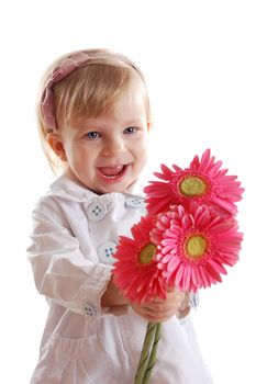 Smiling girl with gerbers over white, focus on girl