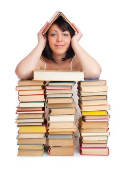 Young smiling woman with heap of books isolated