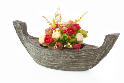 red rose flower with boat vase isolated on white background
