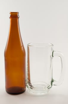 bottle and glass of beer on white background