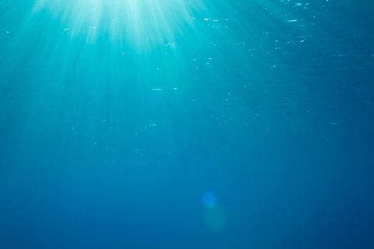 a background with sunbeams underwater
