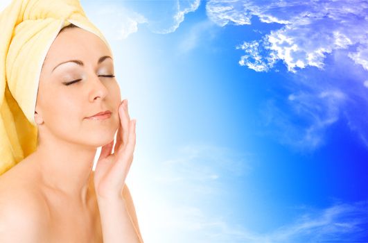 Young woman getting ready for the spa treatment on blue sky background