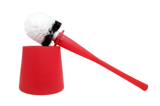 Red brush for cleaning the toilet bowl on a white background