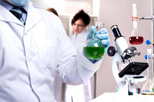 chemist working in the laboratory, mix liquid