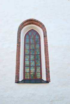 The window in the wall of an old fortress on the island of Suomenlinna.