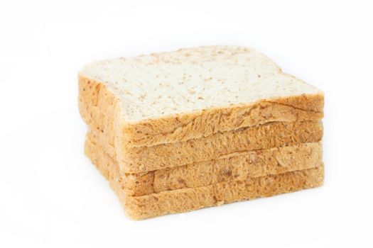 Stack of whole wheat bread on white background