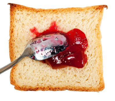 Slice of bread with jam and spoon isolated on white background