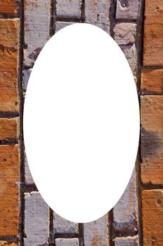 Wall made of red and colored bricks. Architectural decision. Isolated white oval place for text photograph image in center of frame.
