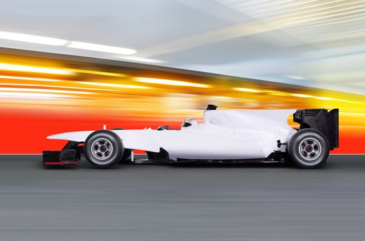 formula one car driving at high speed on empty road - motion blur