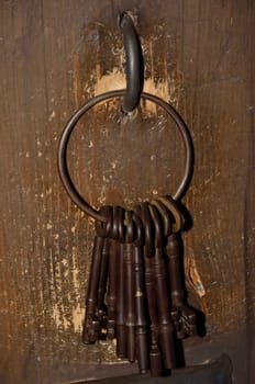 Bunch of old keys with wooden background