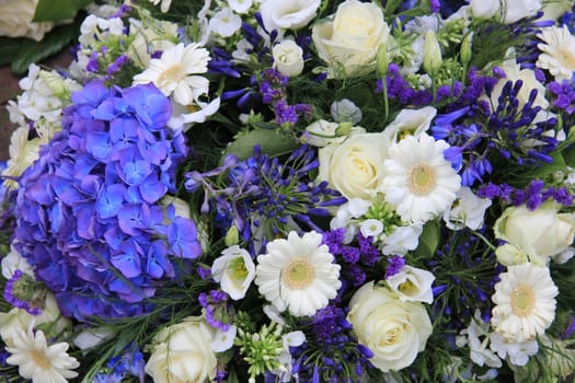 Mixed floral arrangement in white and blue