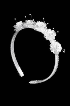 white  floral headband isolated on black background with path.