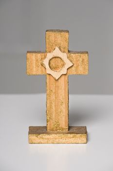 Christian wooden cross on white