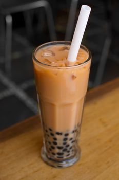 A glass of bubble tea on table.