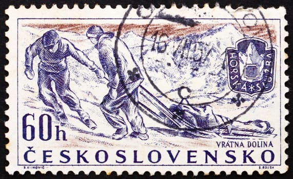 CZECHOSLOVAKIA - CIRCA 1957: a stamp printed in the Czechoslovakia shows Rescue Team, Mountain Climbing Rescue Service, circa 1957