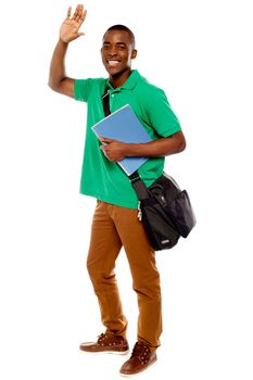 Cheerful student waving his hands. Enjoying himself. all on white background
