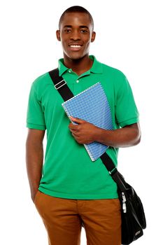 Its study time. Young african student carrying laptop bag and notebook