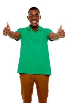 Handsome african showing double thumbs up against white background