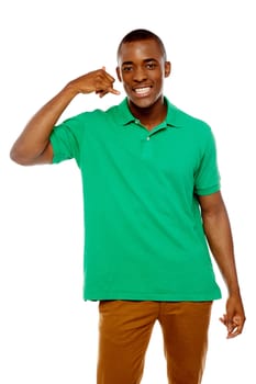 Happy young man with calling gesture over white background