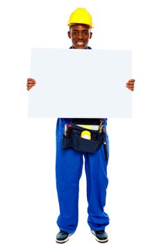 African contractor showing blank billboard, full length shot