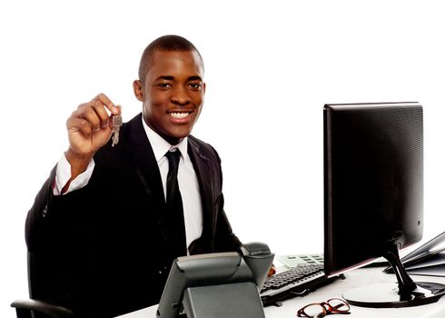 Manager showing office keys to camera isolated against white background