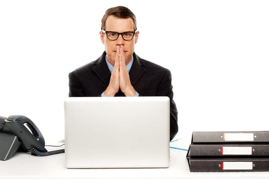 Serious corporate man looking at you isolated over white