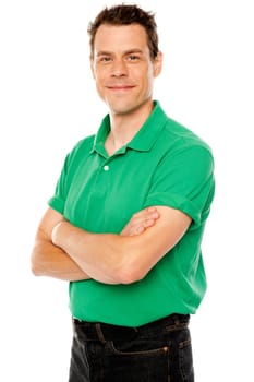 Casual young man with crossed arms isolated over white
