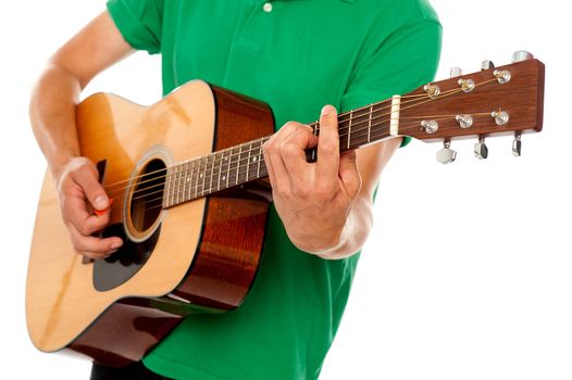 Cropped image of a man playing guitar against white background