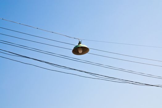 Lanterns on  cables. Electrical cables and clutter.