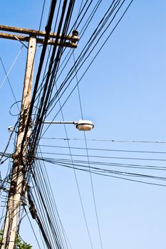 Lanterns on poles. Electrical cables and clutter.