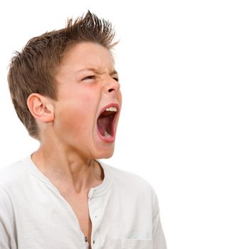 Close up portrait of angry boy shouting. Isolated on white background