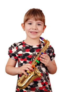 happy little girl with saxophone posing
