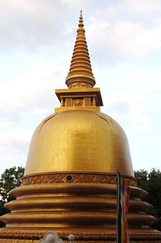 Famous historic golden stupa against the sky in Sri Lanka