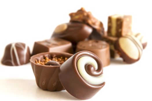 Chocolate candys and truffles on white background