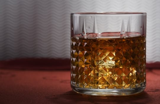 A glass of old whisky on the rocks