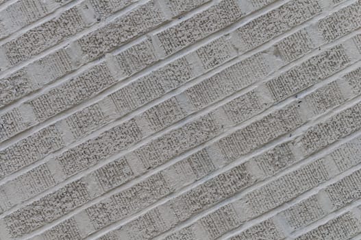 Gray angled rough brick wall background