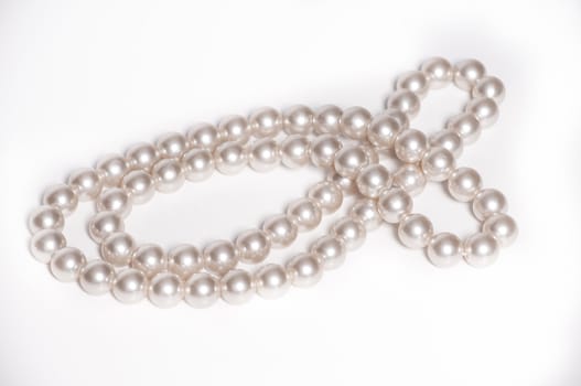 Close up of pearl necklace on isolated white background