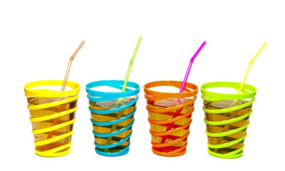 drinks in glasses with red yellow green and blue color with straw