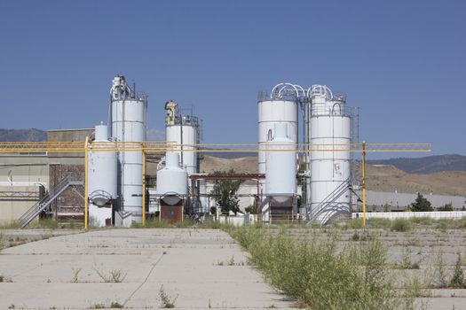 an old abandoned factory with blue skies.