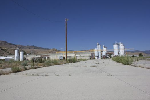 an old abandoned factory with blue skies.