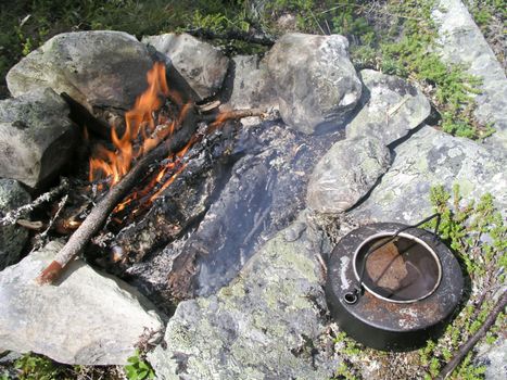 Camp fire in wild mountian