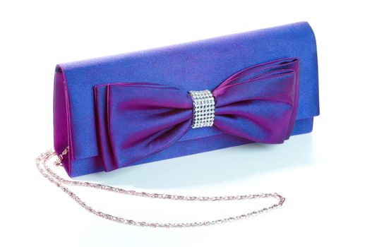 a purple clutch with bow and diamonds.