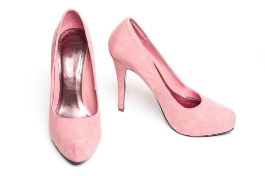 pink suade pumps on white isolated background.