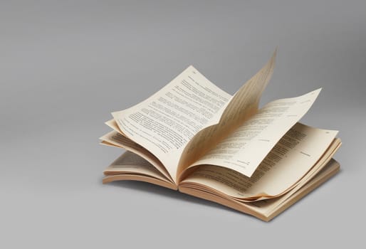 Opened book browsing pages riffling, on grey background