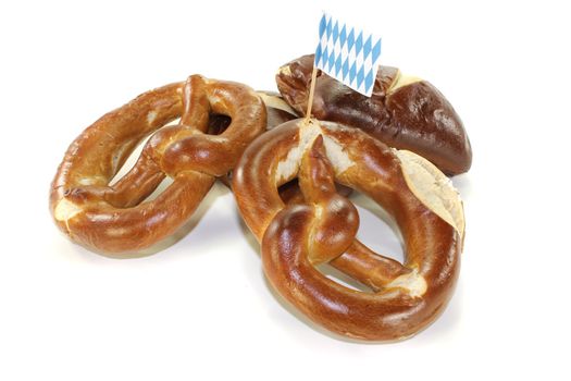 resh Bavarian pretzels with salt on a light background